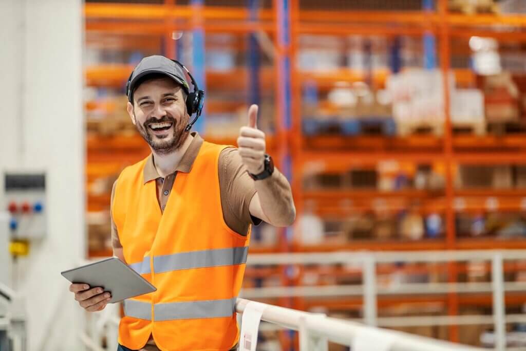 Worker gives thumbs up to show safety standards are met